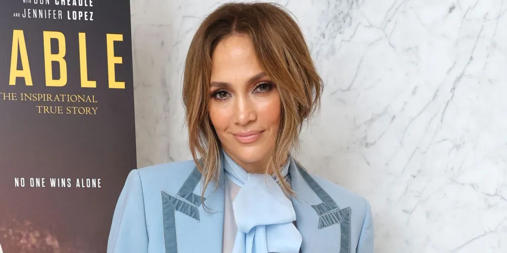 Jennifer Lopez Dressed Down a Suit Jacket With a Sheer Bra-Bearing Top and Y2K Low Rise Jeans