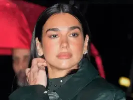 Dua Lipa Traded Her Pants for Feathered Micro Shorts for a Sexy Santa Look