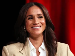 Meghan Markle Pairs Tiny Shorts and a Plunging Shirt on the Beach