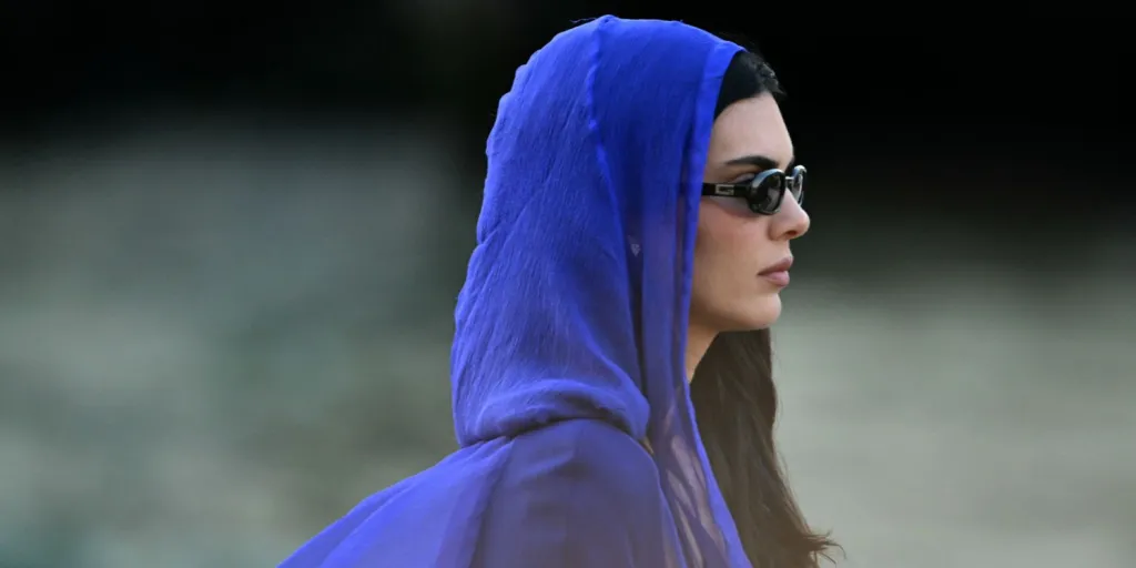 Kendall-Jenner-Goes-Pantsless-in-a-Blue-Blazer-Dress-and-Sheer-Hood-in-Venice Kendall Jenner Goes Pantsless in a Blue Blazer Dress and Sheer Hood in Venice